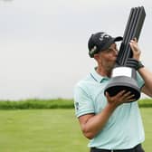 Henrik Stenson, of Sweden, kisses the trophy after winning the individual competition of the LIV Golf Invitational at Trump National in Bedminster.