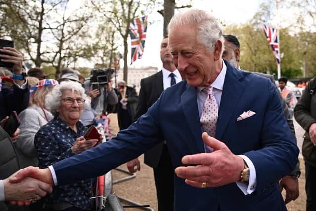 Britain's King Charles III speaks with well-wishers on The Mall near to Buckingham Palace in central London. Picture: Marco Bertorello/AFP via Getty Images