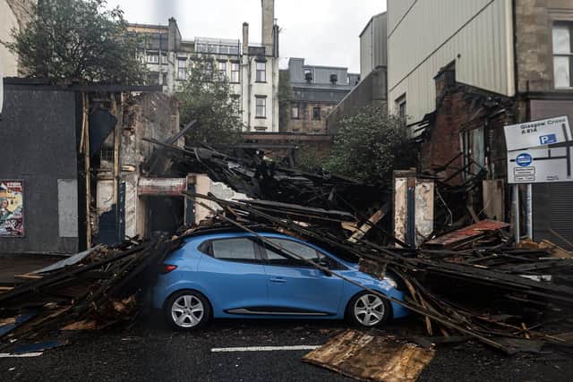 Part of the Broomielaw in Glasgow was closed when a derelict building collapsed as Storm Amy hit harder than expected, leaving more than 60,000 homes without power and causing travel chaos and flooding (Picture: John Devlin)