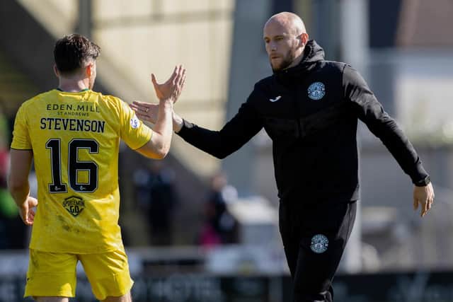 Hibs' Caretaker boss David Gray (R) and Hibs' veteran Lewis Stevenson at full time during a cinch Premiership match between St Mirren and Hibernian at the SMiSA Stadium, on April 23, 2022, in Paisley, Scotland. (Photo by Alan Harvey / SNS Group)