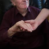 Hospice staff are still holding the hands of dying patients after handwashing by both parties (Picture: John Devlin)