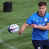 Huw Jones has agreed a deal to join Glasgow Warriors from Harlequins.