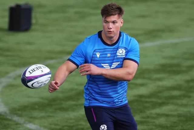 Huw Jones has agreed a deal to join Glasgow Warriors from Harlequins.
