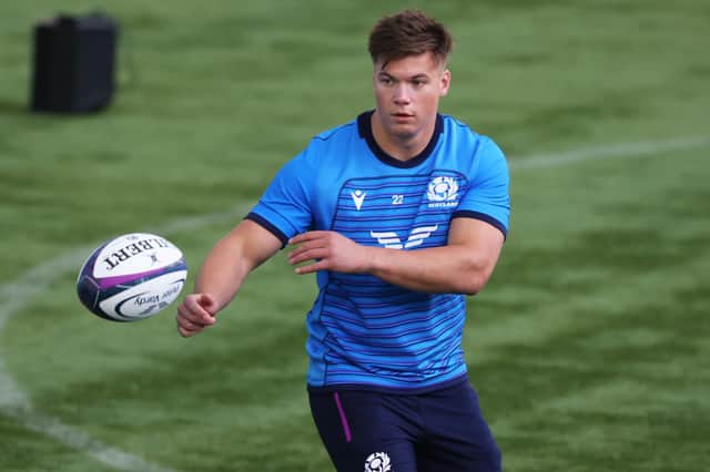 Huw Jones has agreed a deal to join Glasgow Warriors from Harlequins.