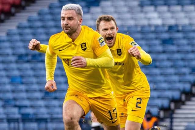 Nicky Devlin chases goalscorer Scott Robinson to celebrate the opening goal in the Betfred Cup semi-final between Livingston and St Mirren at Hampden Park, on January 23, 2021, in Glasgow, Scotland. (Photo by Craig Williamson / SNS Group)