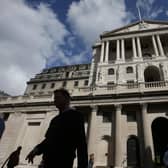 Pedestrians walk past the main entrance of The Bank of England in the City of London. Britain’s big banks can deal with a shock far worse than the economic fallout caused by the pandemic and still continue to lend, the Bank of England believes. Picture: Daniel Leal-Olivas/AFP/Getty Images