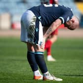 Dundee midfielder Charlie Adam was booked for simulation.