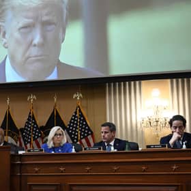 Former US president Donald Trump is seen on a screen during the House select committee hearing. Picture: Brendan Smialowski/AFP/Getty