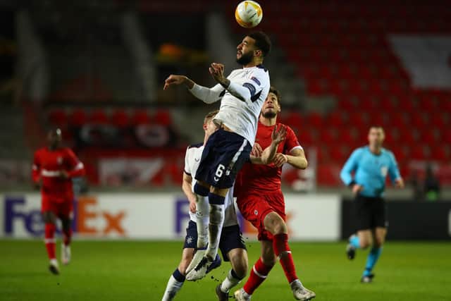 Connor Goldson leaps highest to beat Antwerp striker Felipe Avenatti to the ball during Rangers' Europa League thriller in Belgium on Thursday night. (Photo by Dean Mouhtaropoulos/Getty Images)