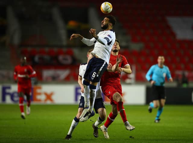 Connor Goldson leaps highest to beat Antwerp striker Felipe Avenatti to the ball during Rangers' Europa League thriller in Belgium on Thursday night. (Photo by Dean Mouhtaropoulos/Getty Images)
