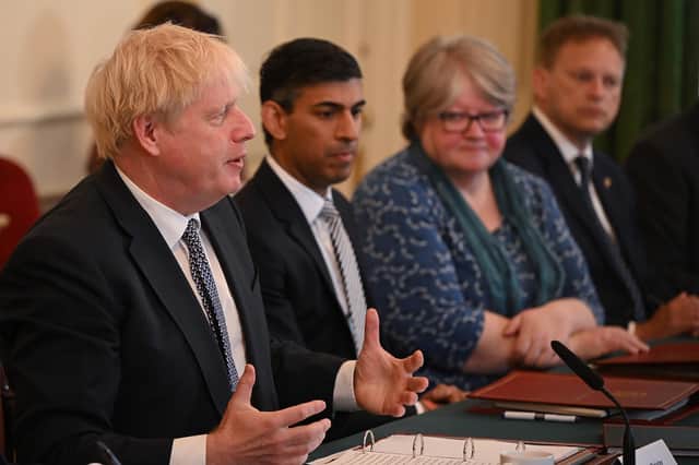 Boris Johnson invited in the cameras for a Cabinet meeting at Downing Street yesterday. Just a few hours later, Chancellor Rishi Sunak resigned (Picture: Justin Tallis/PA)