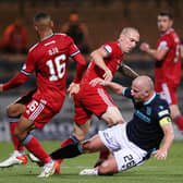 Dundee skipper Charlie Adam (right) tackles opposite number Scott Brown during the Dens Park side's 2-1 win over Aberdeen on Saturday night (Photo by Alan Harvey / SNS Group)
