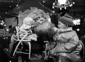 Santa Claus with little boy in Jenners - Edinburgh 1954