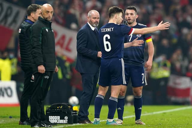 Scotland manager Steve Clarke talks with John McGinn (right) and Kieran Tierney who combined for Scotland's opener. (Photo credit: Andrew Milligan/PA Wire)