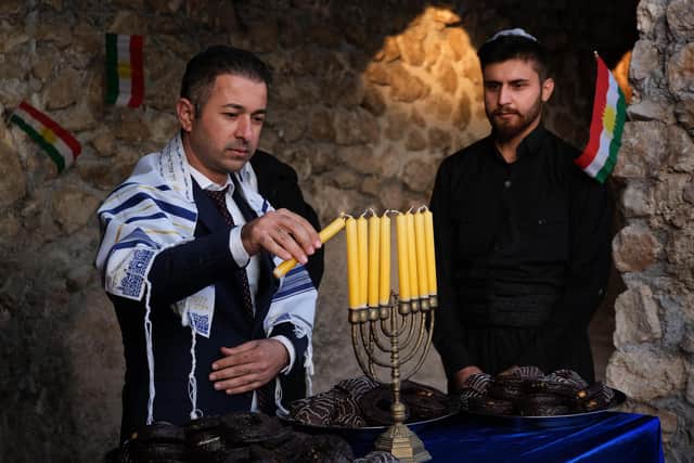 Jewish people all over the world, such as these members of Iraq's Kurdish Jewish community, will mark Hanukkah from December 10 to 18 (Picture: Safin Hamed/AFP via Getty Images)