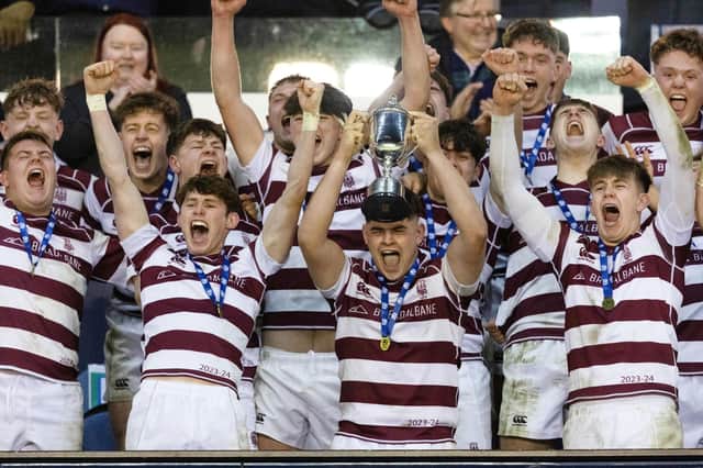 George Watson's lift the trophy after the 42-21 victory over Stewart's Melville at Murrayfield. (Photo by Mark Scates / SNS Group)