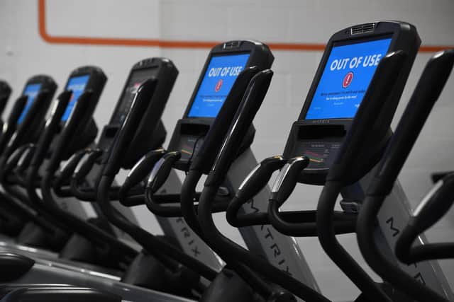 Out Of Use markers on exercise machines inside one of the company's gyms.