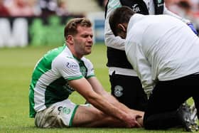 Chris Cadden was forced off with an achilles injury during Hibs' final league game of last season, against city rivals Hearts. Photo by Mark Scates / SNS Group