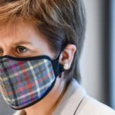 Nicola Sturgeon donned a tartan face mask for the visit to a New Look store at Fort Kinnaird, Edinburgh. Pictures: Jeff Mitchell/Getty
