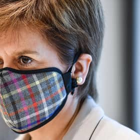Nicola Sturgeon donned a tartan face mask for the visit to a New Look store at Fort Kinnaird, Edinburgh. Pictures: Jeff Mitchell/Getty