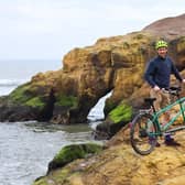 Xani and his tandem posing on cliff