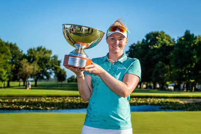 Kylie Henry shows off the trophy after her two-shot victory in the Dimension Data Pro-Am at Fancourt.