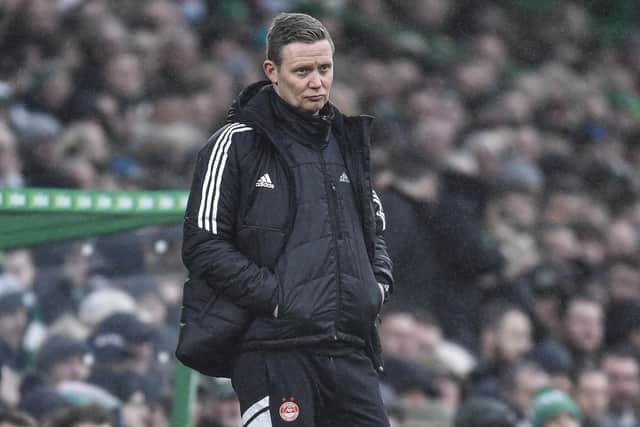 Aberdeen Interim manager Barry Robson sported a dejected look as his side could not prove competitive in losing 4-0 at Celtic Park. (Photo by Ross MacDonald / SNS Group)