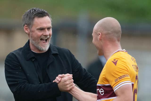 Motherwell manager Graham Alexander shares his delight with matchwinner Liam Grimshaw. Photo by Craig Foy / SNS Group
