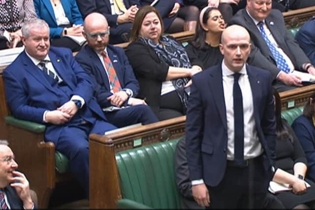 Stephen Flynn, new leader of the Westminster SNP group, is watched by his predecessor, Ian Blackford, as he makes a point in the Commons (Picture: House of Commons/PA)