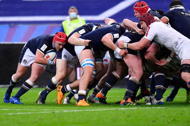 Hooker George Turner at the tail of the scrum makes the break which leads to Scotland's first try.