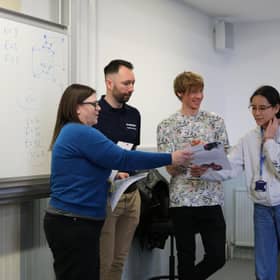 Tom Rocks Maths with students at Maths Masterclass Final