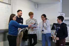 Tom Rocks Maths with students at Maths Masterclass Final