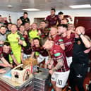 Stenhousemuir get the title party started in their dressing-room after winning League Two.