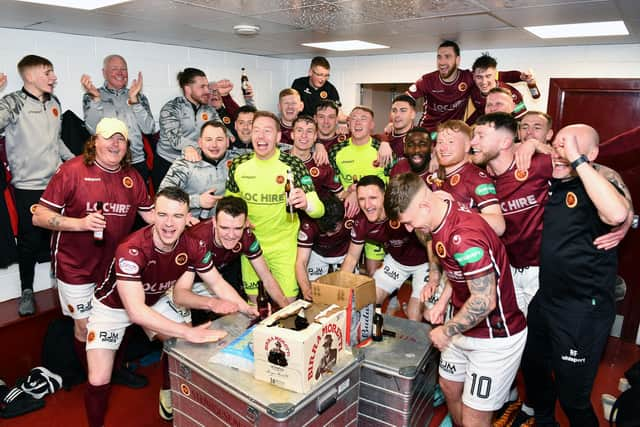 Stenhousemuir get the title party started in their dressing-room after winning League Two.