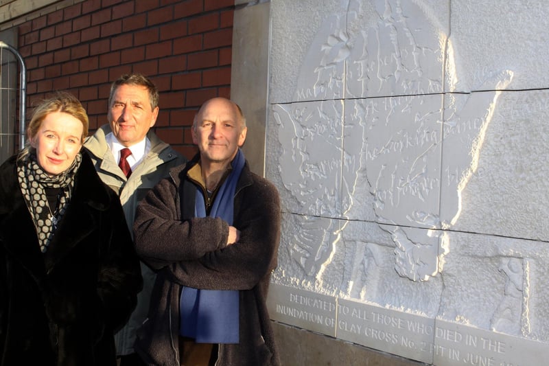 Coun Peter Riggott,  artist Peter Maris and Clay PR representative Carolyn Lord unveil a memorial in  2011 to mark the mining disaster in Clay Cross in 1865.