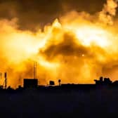 Explosions erupt during Israeli bombardment in the northern Gaza Strip near a position along Israel's southern border.