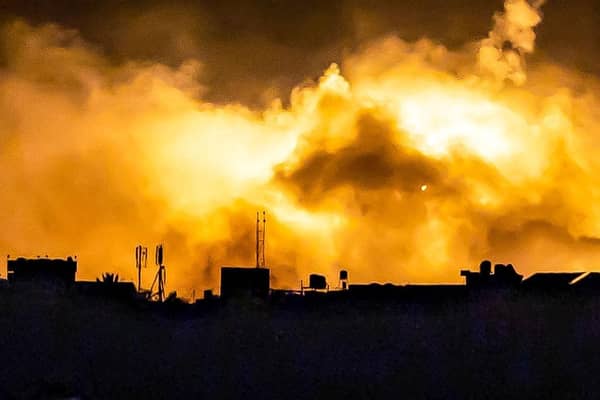 Explosions erupt during Israeli bombardment in the northern Gaza Strip near a position along Israel's southern border.