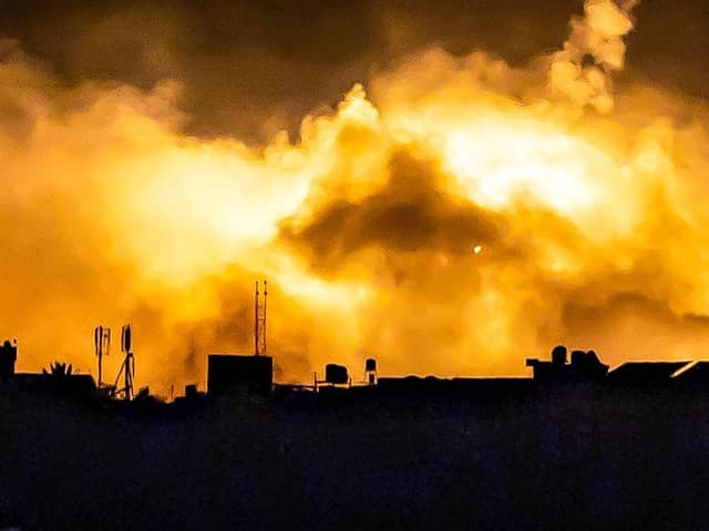 Explosions erupt during Israeli bombardment in the northern Gaza Strip near a position along Israel's southern border.