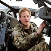 Prince Harry, back in the days when he had a proper job, makes pre-flight checks at Camp Bastion in Afghanistan (Picture: John Stillwell/PA)