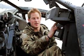 Prince Harry, back in the days when he had a proper job, makes pre-flight checks at Camp Bastion in Afghanistan (Picture: John Stillwell/PA)