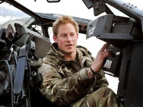 Prince Harry, back in the days when he had a proper job, makes pre-flight checks at Camp Bastion in Afghanistan (Picture: John Stillwell/PA)