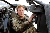 Prince Harry, back in the days when he had a proper job, makes pre-flight checks at Camp Bastion in Afghanistan (Picture: John Stillwell/PA)