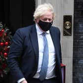 Prime Minister Boris Johnson leaves Downing Street to attend Prime Minister's Questions on Wednesday
