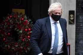 Prime Minister Boris Johnson leaves Downing Street to attend Prime Minister's Questions on Wednesday
