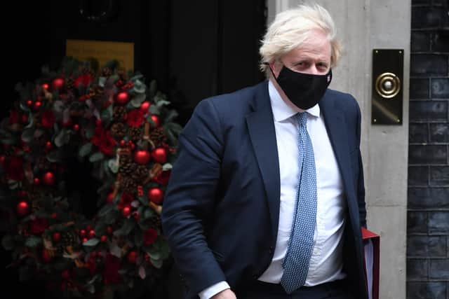 Prime Minister Boris Johnson leaves Downing Street to attend Prime Minister's Questions on Wednesday