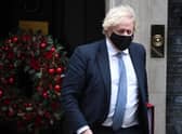 Prime Minister Boris Johnson leaves Downing Street to attend Prime Minister's Questions on Wednesday