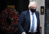 Prime Minister Boris Johnson leaves Downing Street to attend Prime Minister's Questions on Wednesday