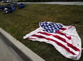 Empty chairs and an American flag blanket lie on the ground after a mass shooting at the Highland Park Fourth of July parade in downtown Highland Park, a suburb in Chicago. Picture: AP Photo/Nam Y. Huh