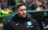 Hibs manager Lee Johnson watches on as his team go down 3-0 to Hearts.