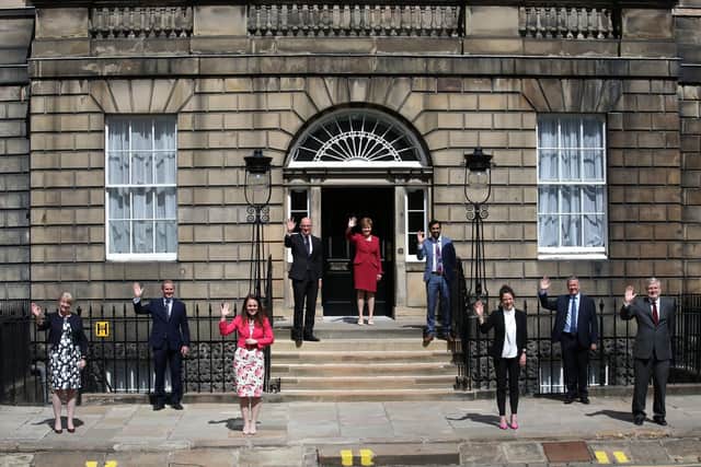 First Minister Nicola Sturgeon(c) alongside her newly formed Cabinet l-r Shona Robison, Michael Matheson, Kate Forbes, John Swinney, Humza Yousaf, Mairi Gougeon , Keith Brown and Angus Robertson on the steps of Bute House in Edinburgh.